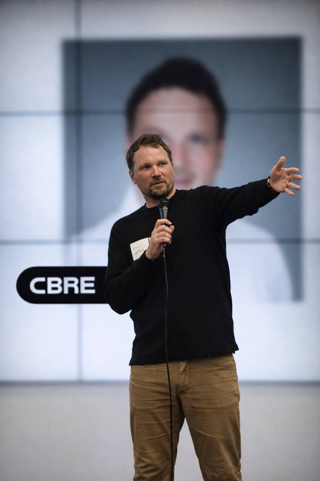 A speaker presenting on stage at an Inworld event.